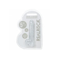 Clear silicone dildo in packaging with 'Real Rock' branding on a white background