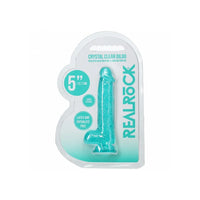 Crystal clear dildo in packaging with 'Real Rock' branding on a white background