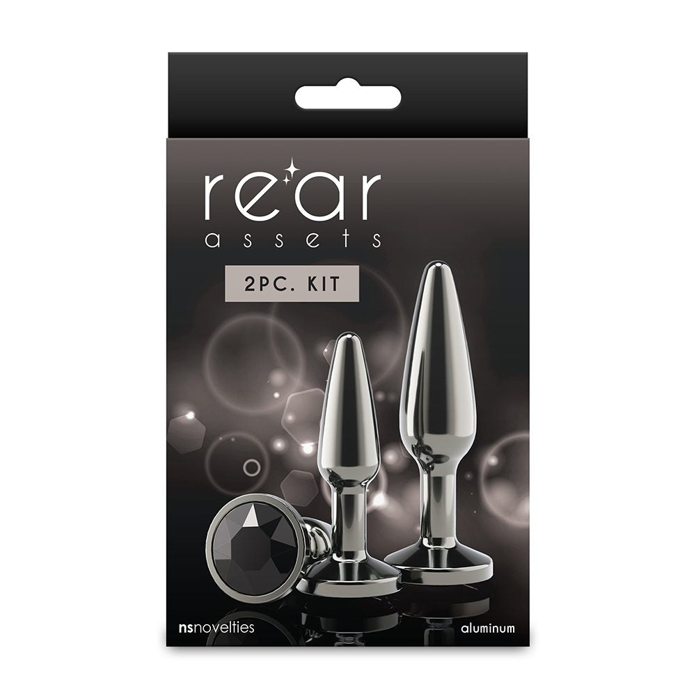 Packaging of 'rear assets' 2PC. Kit with two metallic products on a dark background.