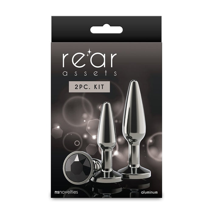 Packaging of 'rear assets' 2PC. Kit with two metallic products on a dark background.