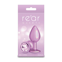 medium anal plug with gem circle on bottom in lilac on box cover