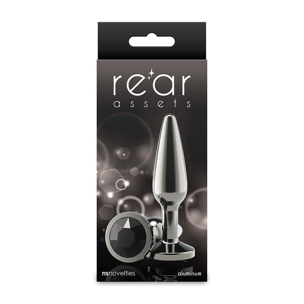 Packaging of a metallic anal plug with 'rear assets' branding on a white background.