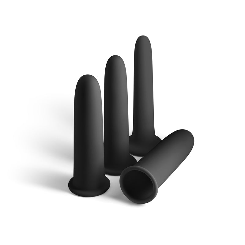 Set of black silicone dilators plugs on a white background