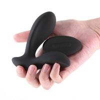 Renegade Rain rechargeable anal vibrating plug  held in a hand on a white background