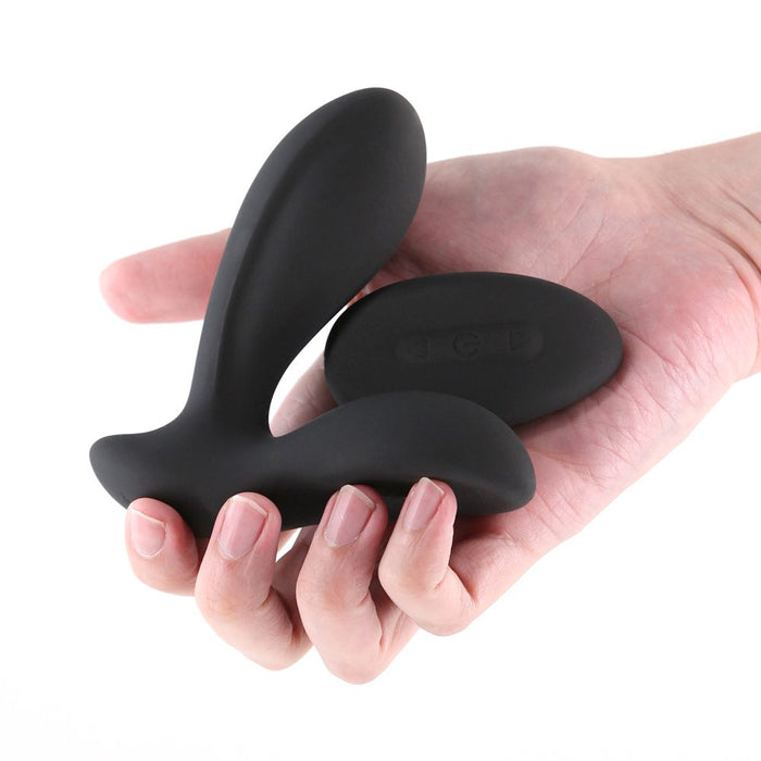 Renegade Rain rechargeable anal vibrating plug  held in a hand on a white background