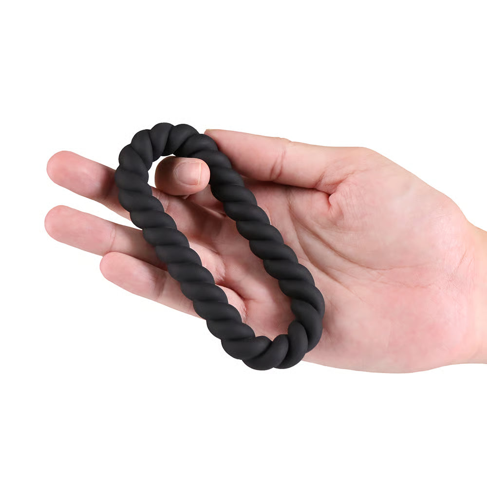 renegade helix braided cock ring held in hand