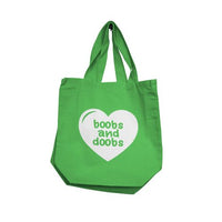 Green tote bag with a white heart and text on a white background with boobs and doobs