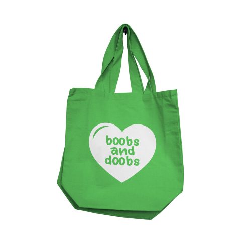 Green tote bag with a white heart and text on a white background with boobs and doobs