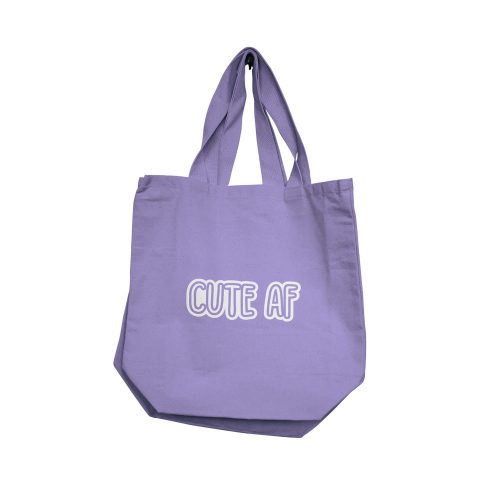 Purple tote bag with 'CUTE AF' text on a white background