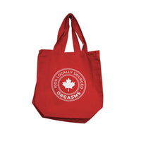 Red tote bag with 100% locally sourced orgasms on white graphic and text on a white background