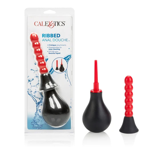 a black bulb douche with a thin nozzle. There is also a ribbed nozzle attachment. Shown next to its plastic packaging