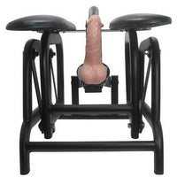 front view of black ride and slide sex machine with beige dildo in between the seat padding