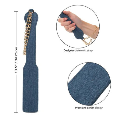 a blue denim paddle with a gold chain wrist strap