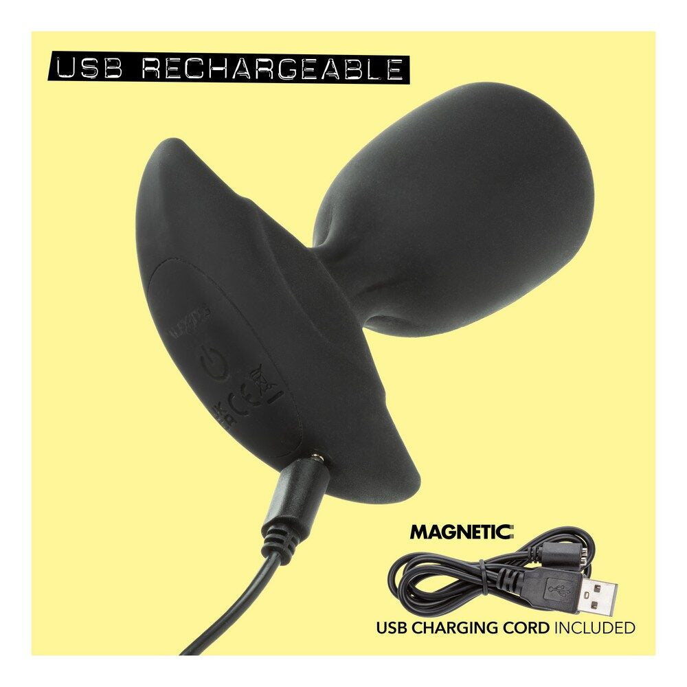 Black USB rechargeable anal plug with magnetic feature on a yellow background