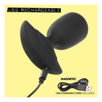 Black USB rechargeable anal plug with magnetic feature on a yellow background