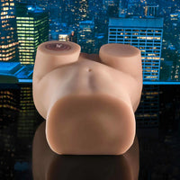 Mannequin torso against a cityscape at night