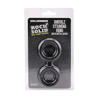 Packaged double stamina cock ring with metal beads on a white background