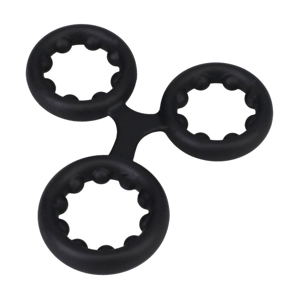 Black rock solid triple cock ring with metal beads on a white background