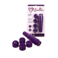 a purple flat tipped clitoral vibrator with three silver balls on the top and 4 interchangeable smooth or studded caps, shown next to its plastic packaging