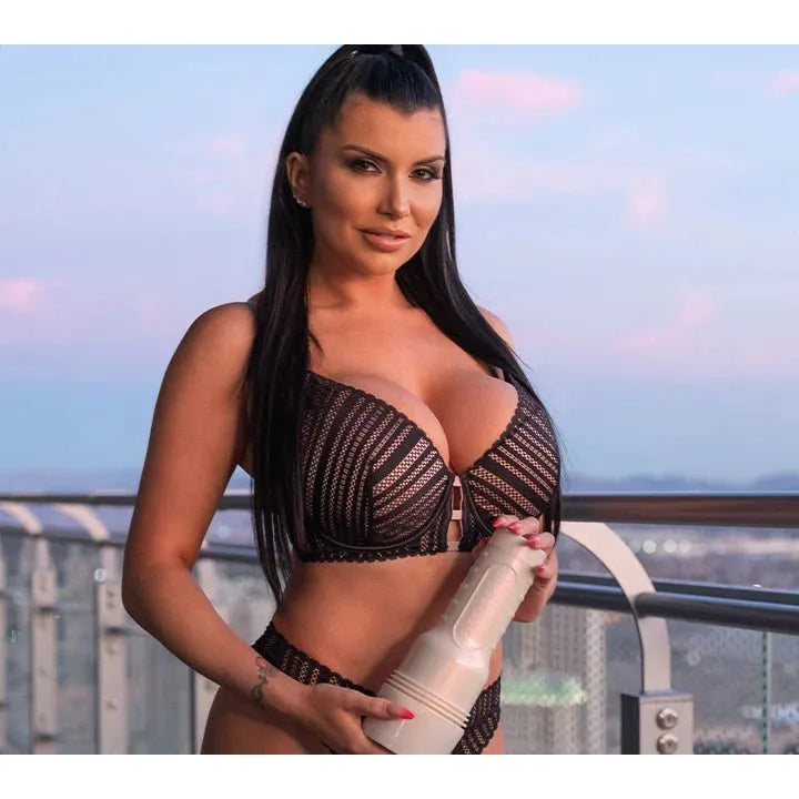 romi rain in a black lace outfit holding a fleshlight  on a balcony with cityscape background