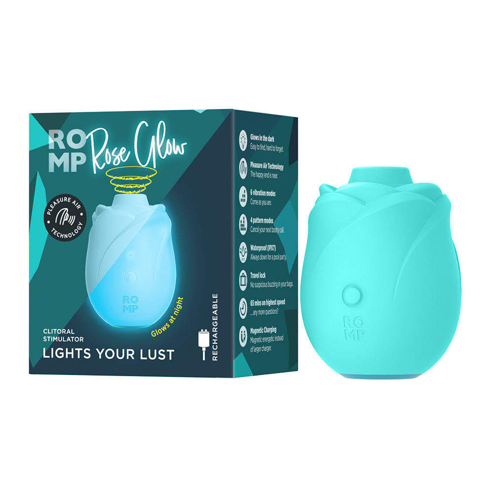 Turquoise clitoral stimulator with packaging on a white background