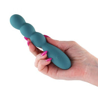 Hand holding a green rosa vibrator teal  on a white background