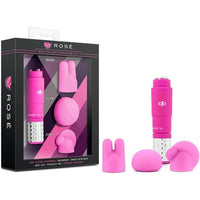 a pink clitoral vibrator with three silver balls on the top and a silver base. There are three pink interchangeable heads shown next to its black packaging
