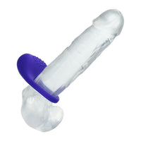 A clear silicone adult novelty product with a textured purple base, shown on a plain white background.
