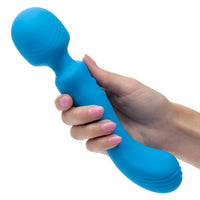 Blue handheld massager held by a hand with pink nail polish on a white background
