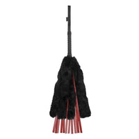red leather flogger with black faux fur cover 