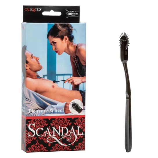 a black handle with a rotating wheel with spikes on it. Shown next to its display box that depicts a couple on a bed. The woman is using the product on the mans chest