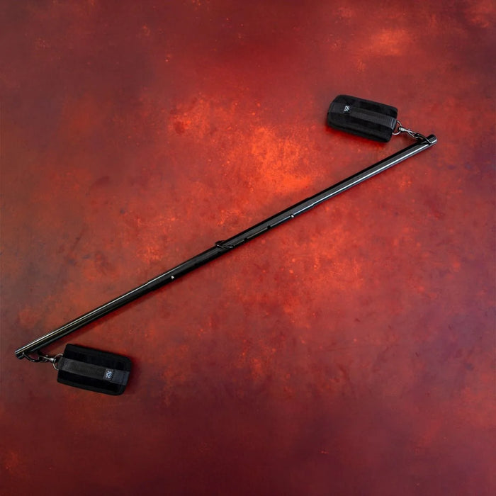 black spreader bar on red background