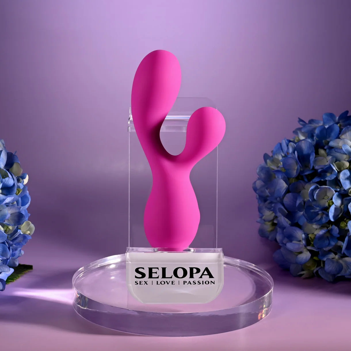 pink vibrator with bulb head and clitoral stimulator in stand