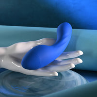 blue g spot vibrator with thicker bottom, held in hand