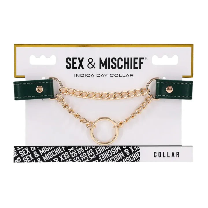 Sex & Mischief collar on packaging with green leather and gold chain