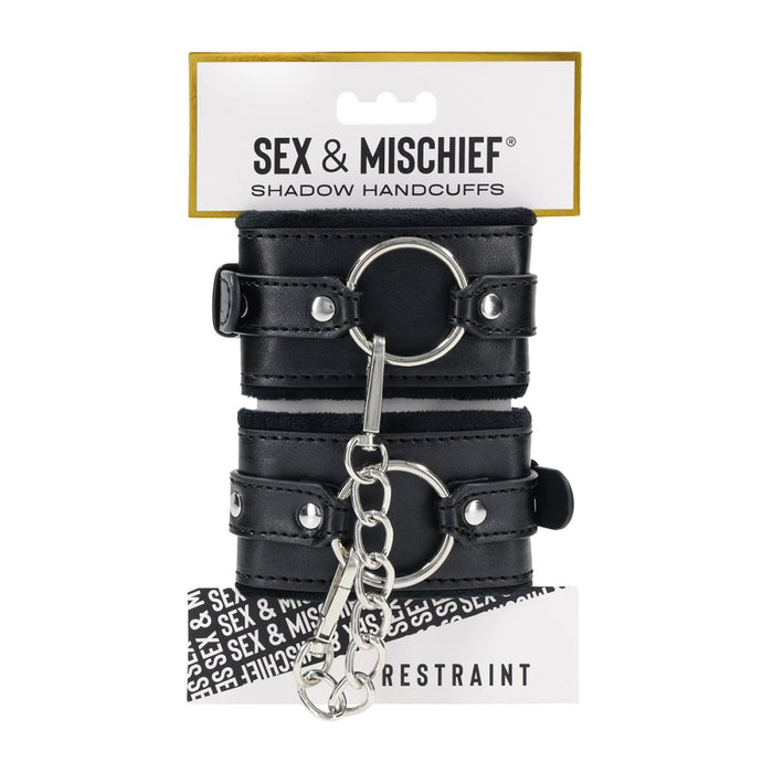 Black leather handcuffs with silver rings on a white background, branded 'Sex & Mischief'.