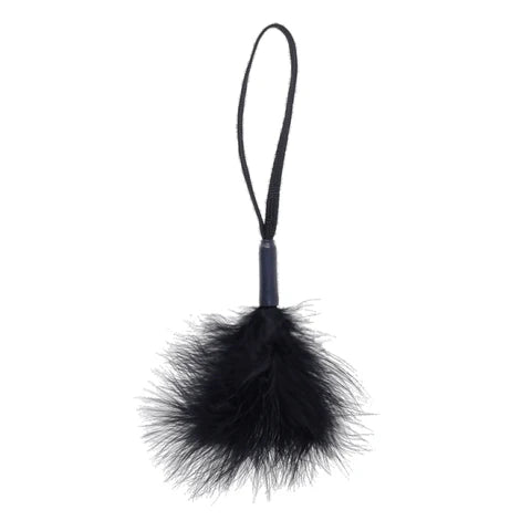 black feathered wrist tickler with a black string on a white background