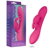 Pink silicone sexy things wild rabbit vibrator with packaging on a white background