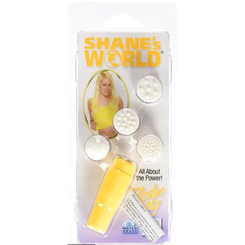 a yellow clitoral vibrator with three silver balls on its flat top and four different textured interchangeable tops, shown with its plastic packaging