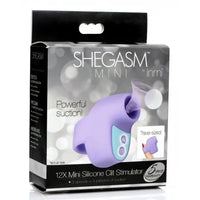SheGasm Mini clitoral stimulator product packaging with purple silicone stimulator on a gray background