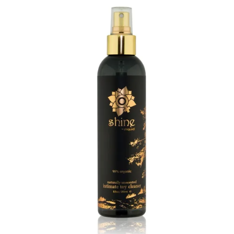 Black bottle with gold cap and shine natural toy cleaner sliquid branding on a white background