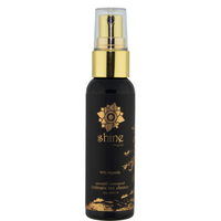 Black bottle with gold cap labeled 'shine' natural toy cleaner on a white background