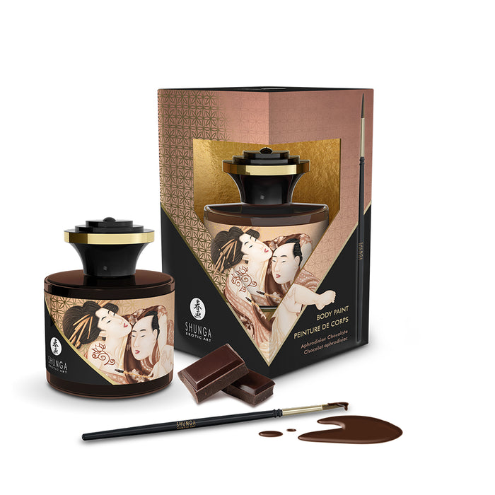 Shunga body paint set with packaging, brush, and chocolate on a white background