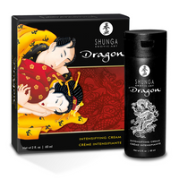 a black bottle of dragon cream beside box packaging