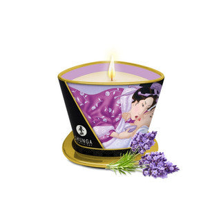 Candle in a decorative container with 'Shunga' branding, featuring an illustration of a couple and lavender flowers on a white background.