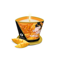 Candle with 'Shunga' branding and mango design on a white background
