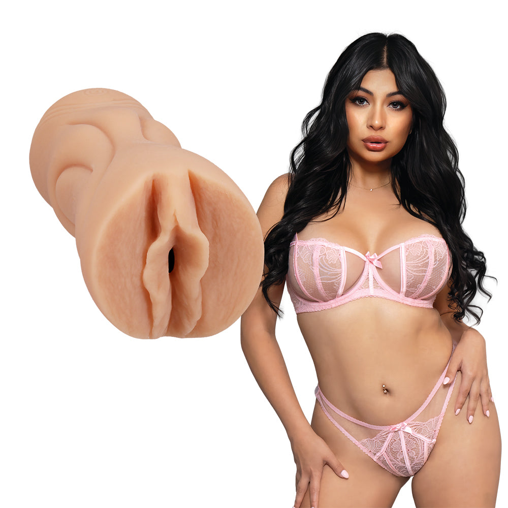 adult star cami strella standing beside molded vagina masturbator