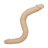 Beige silicone double didlo on a white background