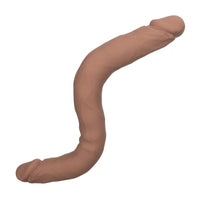 Beige silicone double dildo on a white background