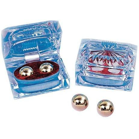 pair of silver ben wa balls in clear case with red velvet lining
